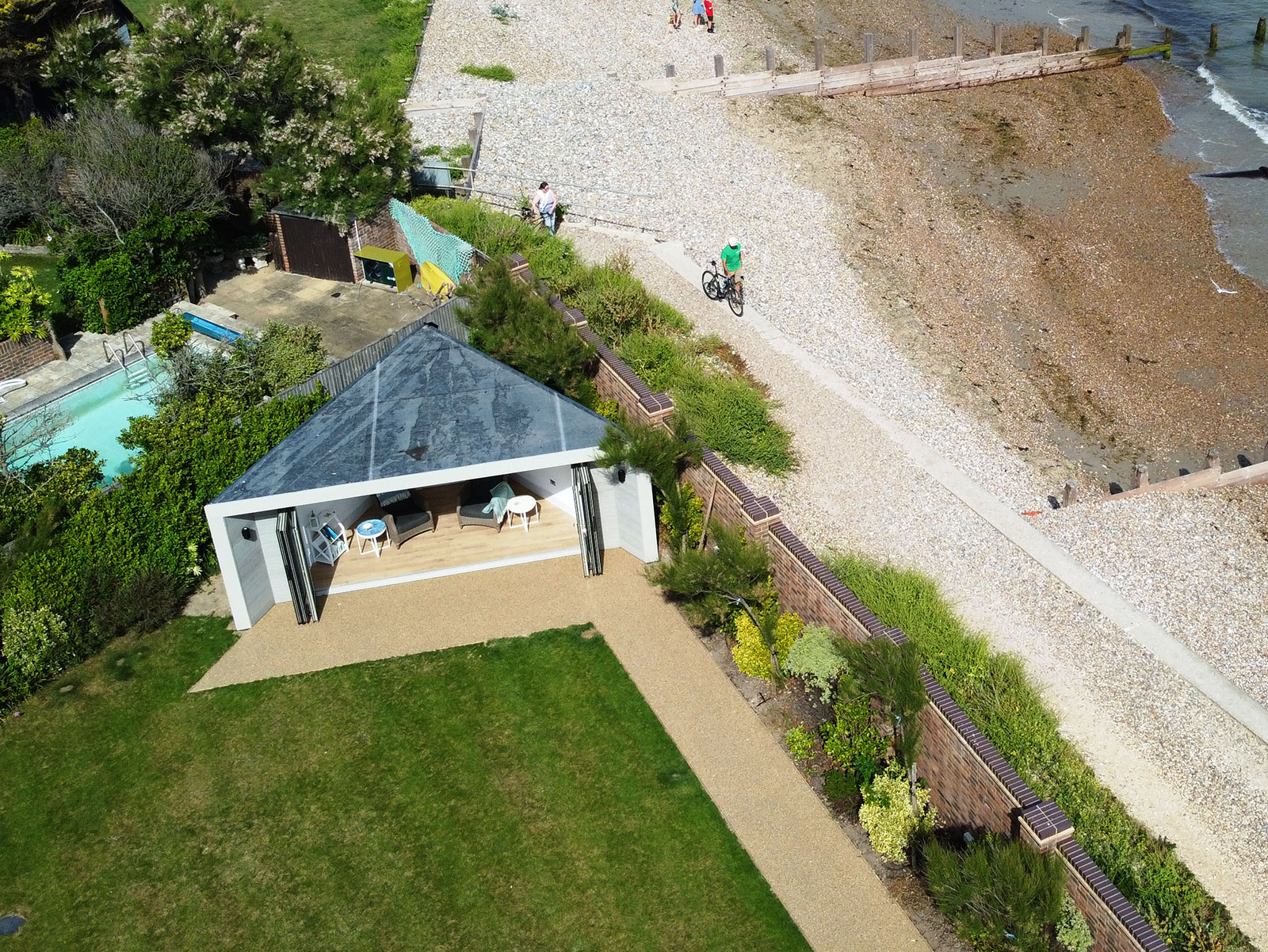 Designer triangular corner summerhouse by the sea