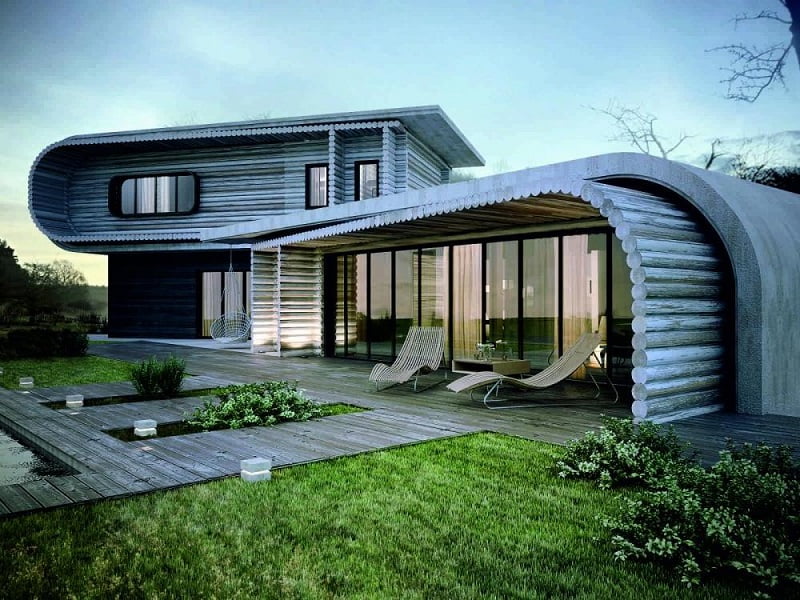 Modern house with a unique curved architectural design, featuring large glass windows, a wooden deck with lounge chairs, and well-maintained lawn and greenery. The exterior blends wood and concrete elements, showcasing contemporary architecture while maintaining a natural aesthetic. - a room in the garden