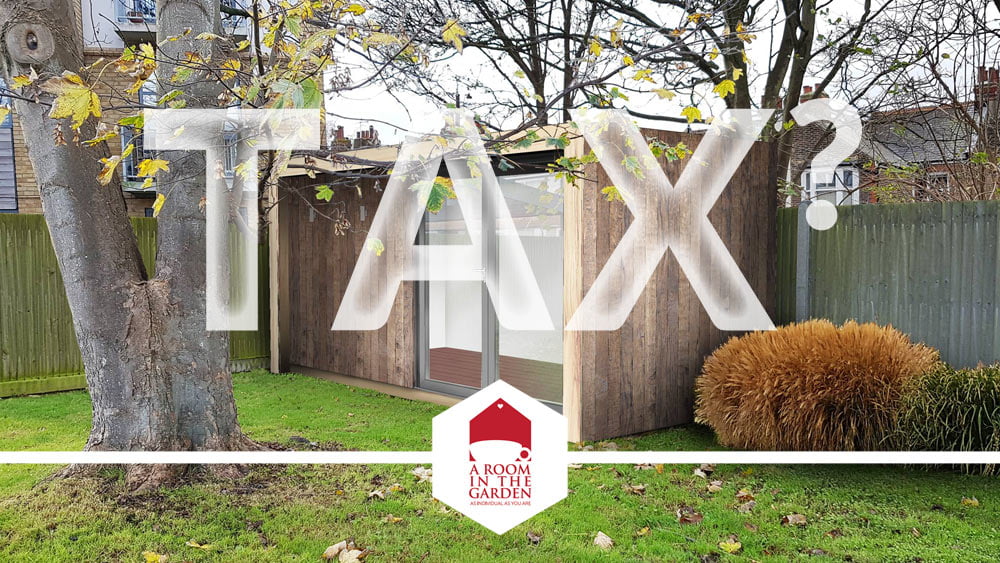 A small, modern wooden garden office surrounded by trees and plants with large letters "TAX?" superimposed across the image. A logo at the bottom reads "A Room in the Garden. - a room in the garden