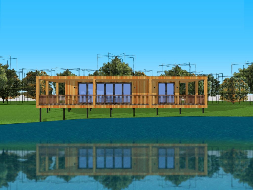 A modern wooden house on stilts is reflected in a calm body of water. Featuring large windows and glass doors, it provides a view of the surrounding grassy landscape with trees. The sky is clear and blue, enhancing the spacious deck across the front, reminiscent of designer garden rooms. - a room in the garden