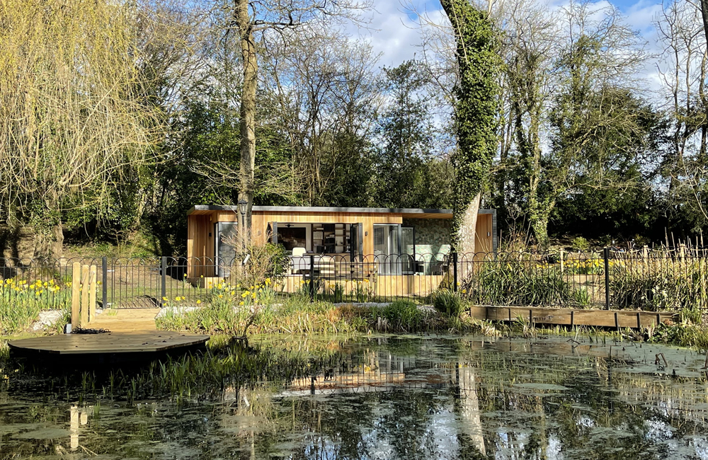 Unique garden office by a pond