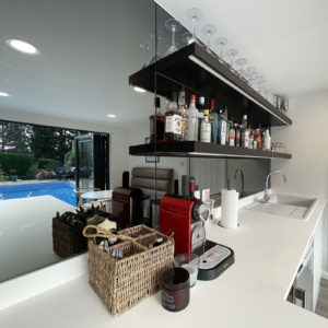 Unique design poolhouse interior with bar