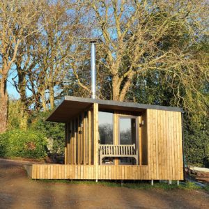 Exterior design of garden office with chimney