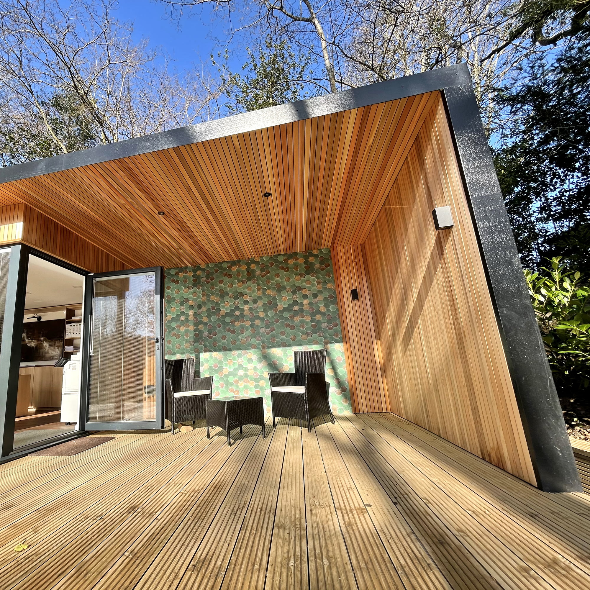 External outdoor wallpaper and roof overhang for unique designer garden office