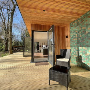 Outdoor wallpaper and sitting area for large unique garden office
