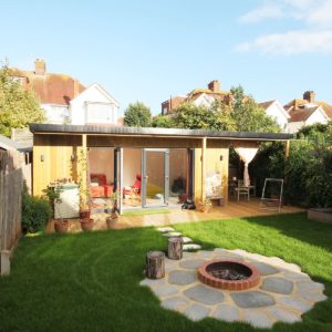 Designer unique summerhouse garden room with bonfire