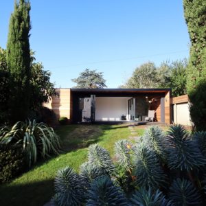 Exterior design of designer unique garden room with roof overhang