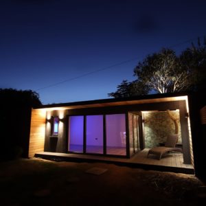 Bespoke unique garden room summerhouse with outdoor wallpaper and sitting area