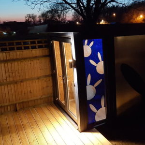 Custom stained glass windows for unique garden storage room