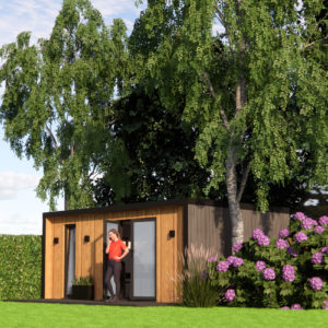 A small wooden cabin with large windows set in a lush green garden stands as one of the most charming garden buildings. A person stands at the doorway. Trees and flowering bushes surround the cabin, and the sky is partly cloudy. The well-maintained lawn adds to the array of various plants. - a room in the garden
