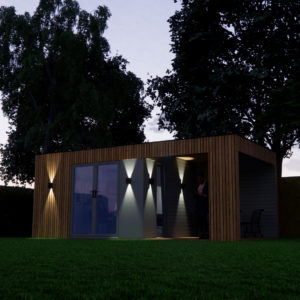 A modern wooden garden shed with large glass doors, illuminated by exterior lights, stands surrounded by lush green grass and tall trees in the evening. The interior light casts a soft glow, revealing a person inside. - a room in the garden