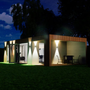 A modern, rectangular glass and wood building is illuminated at dusk, showcasing sleek interiors. It features large windows, with lit interiors revealing furniture. Exterior spotlights create dramatic lighting effects on the wooden facade, and a lawn surrounds the structure. - a room in the garden