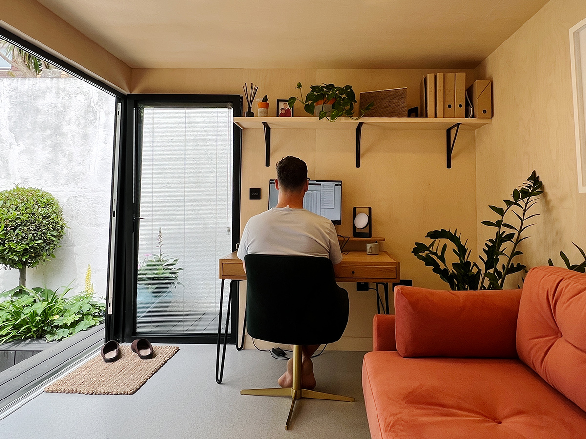 Interior of bespoke garden office with plywood walls