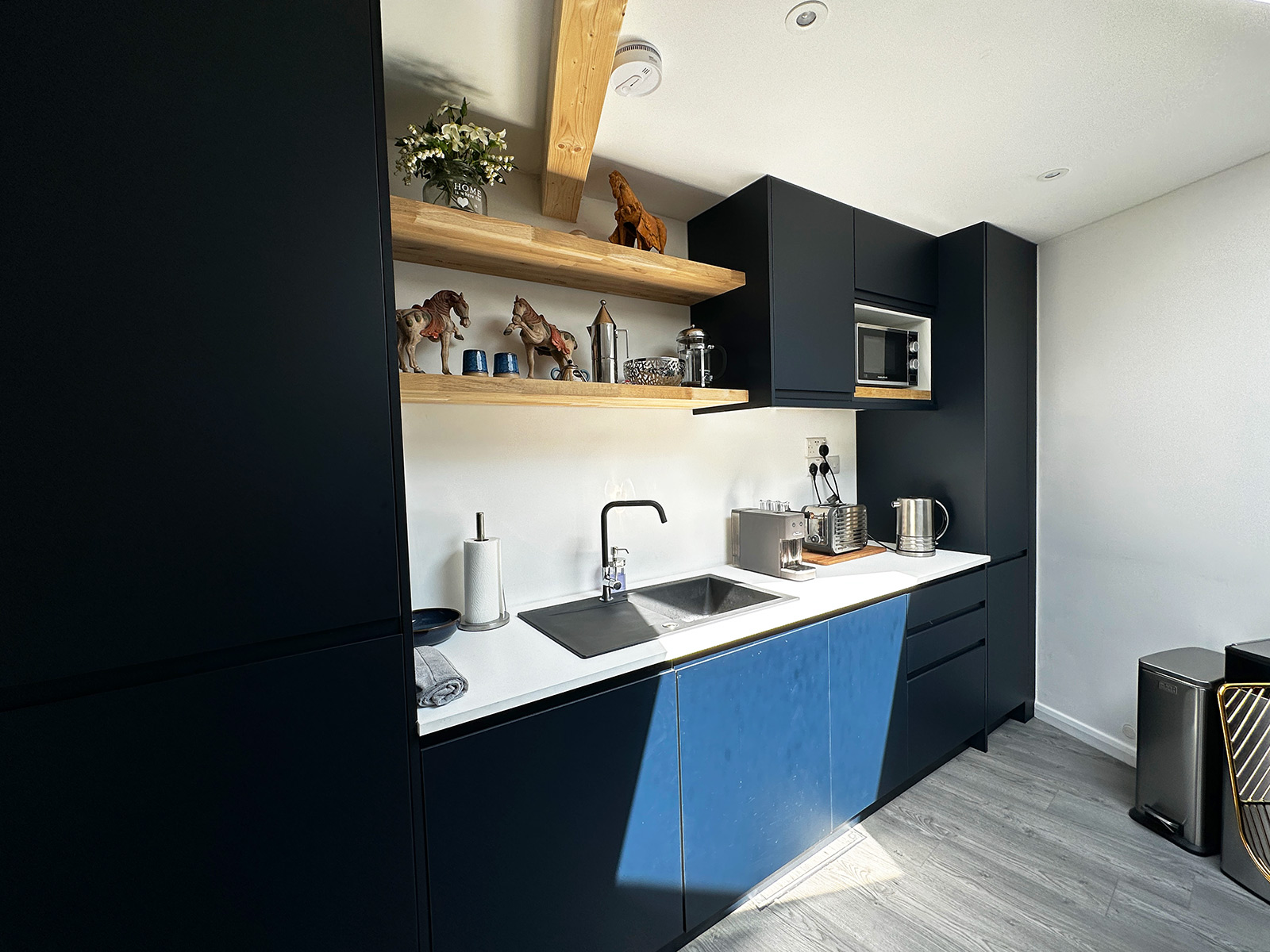 Mobile home kitchen with navy blue finish