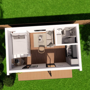 Aerial view of a small, modern studio apartment with wooden floors. The space includes a bed, a sitting area with chairs and a coffee table, a small kitchen, a bathroom, and a desk. A wooden deck extends from the entrance, surrounded by green grass—ideal for those interested in stylish mobile homes. - a room in the garden