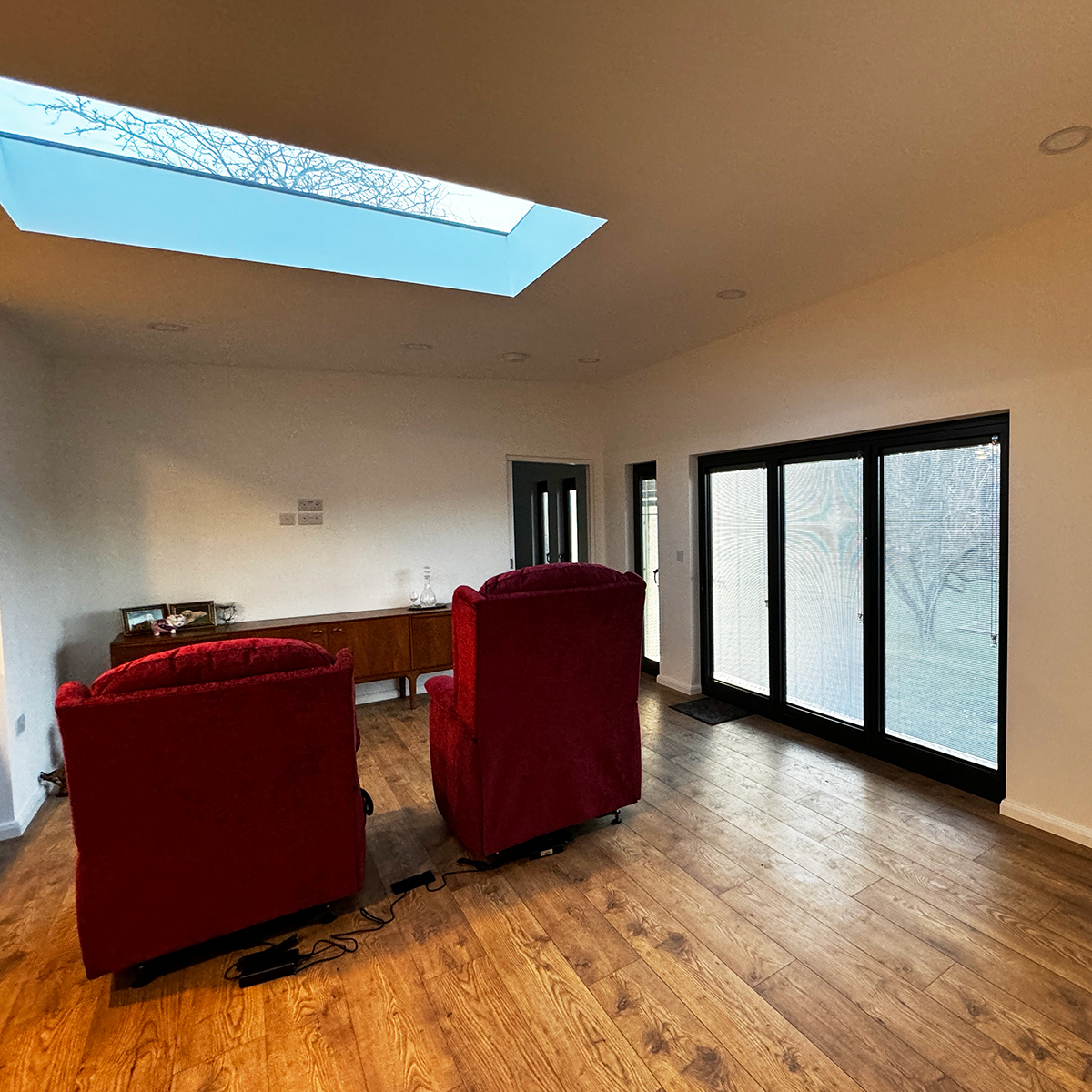 Interior of lounge area with skylight inside mobile home
